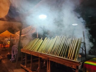 Malaysia's Lemang, a seasonal delight, blends glutinous rice, and coconut milk, roasted in bamboo...