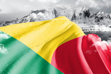 Benin national flag cloth fabric waving on beautiful ice Mountain Background.