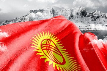 Kyrgyzstan national flag cloth fabric waving on beautiful ice Mountain Background.