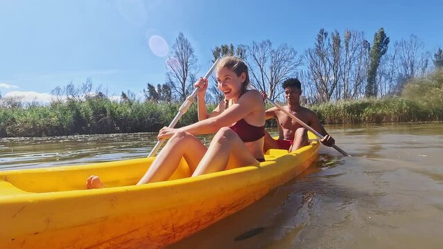 Boat, kayak and couple on river in nature for holiday, summer vacation and weekend outdoors. Water sports, travel and man and woman in canoe on lake for adventure, fun activity and hobby together
