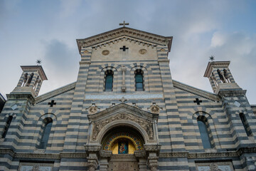 Detail of symmetrical facade of the Our Lady of the Snows church in neo-romanesque style, La Spezia...