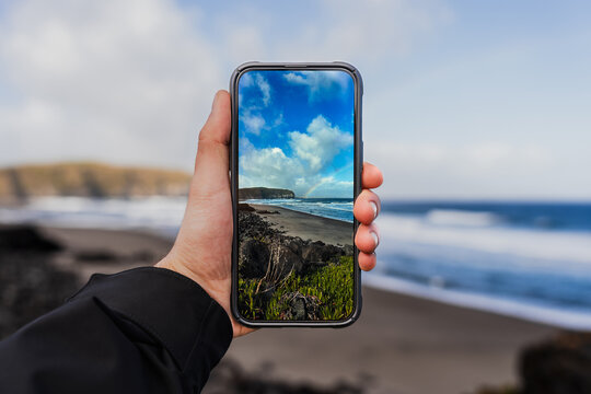 Smartphone capturing scenic view of S&atilde;o Miguel beach