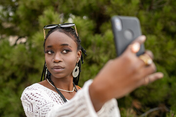 African American Girl Taking Selfie Outdoors