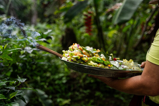 Traditional Balinese Canang Sari offerings in lush greenery