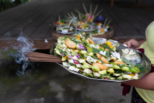Traditional Balinese Canang Sari Offerings with Incense Smoke