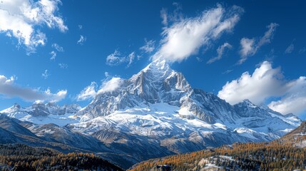   A majestic snow-capped mountain range under a bright blue sky with fluffy clouds in the background, dotted with a couple of tall trees in the foreground