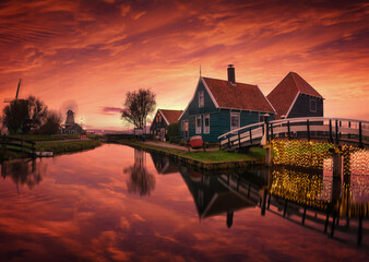 Serene sunset over traditional Dutch houses in Amsterdam