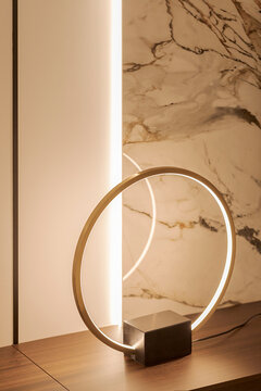 Modern Circular LED Desk Lamp Against Marble Background