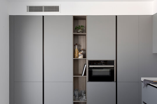Sleek modern kitchen with grey cabinetry and appliances