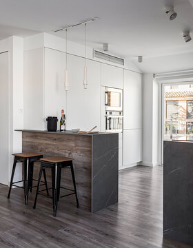 Modern kitchen interior with white and wood design elements