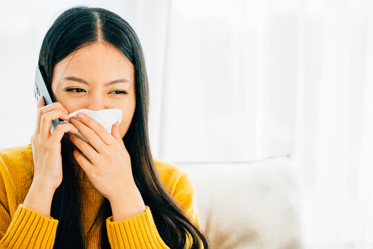 Amidst Blowing Wiping Nose Sneezing On Sofa A Sick Female Contacts Doctor. An Ill Young Girl Discusses Influenza Symptoms With Practitioner Via Phone Seeking Medicine. Conveying Patient Care At Home.