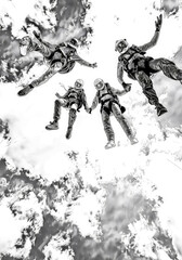 Obraz premium Multiple individuals soaring through the air while skiing together in a thrilling display of athleticism and teamwork