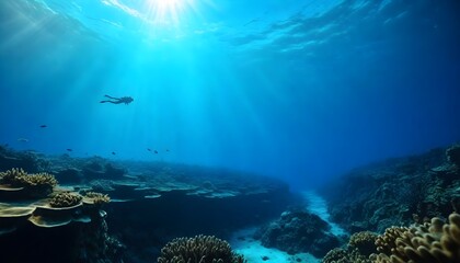 Underwater ocean - blue abyss with sunlight - diving and snorkeling. The concept of exploring the underwater world.
