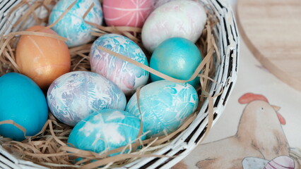 Easter eggs in a basket. Easter composition. Holiday concept.