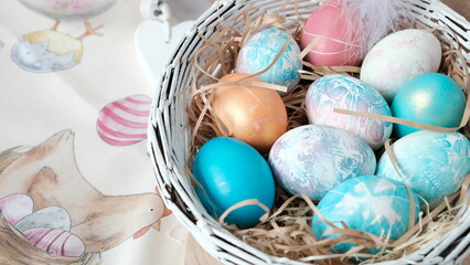 Easter eggs in a basket. Easter composition. Holiday concept.