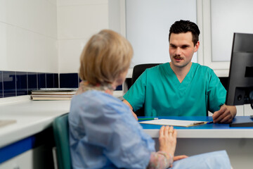consultation between a doctor and an elderly patient in a plastic surgery clinic