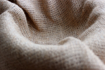 Selective and partial focus burlap fabric in nest shape background 
