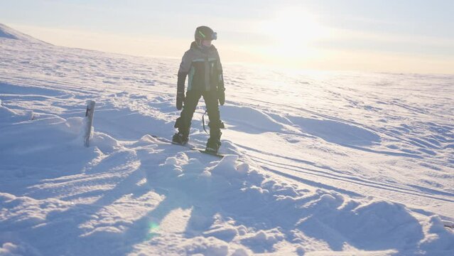 Boy's Adventure Snowboarding Under The Sun
