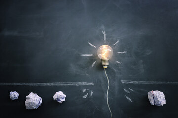 Education concept image. Creative idea and innovation. light bulb metaphor over blackboard background - 781306605