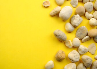 The background is yellow. Yellow stones lie smooth, the background with stones is yellow. good image quality
