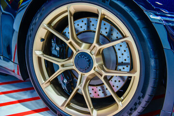 Close up Car alloy wheel and disc-brake sport car