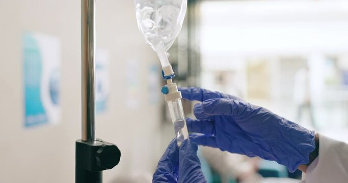 Hospital, IV drip and hands of nurse check for medicine, infusion and medication dose for patient. Healthcare, clinic and closeup of person with liquid for treatment, sickness and medical care