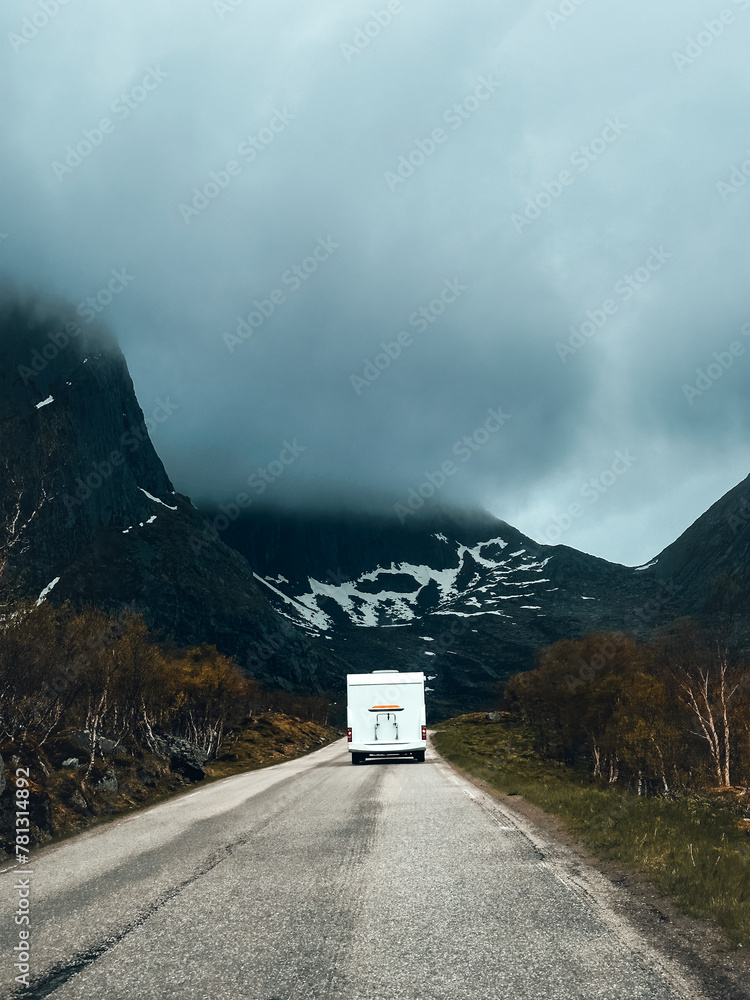 Wall mural Camper van on the road trip vacations in Norway travel RV trailer  weekend caravan tourism in Lofoten islands moody nature mountains landscape