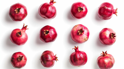 Set of fresh pomegranates isolated on a white background, top view, showcasing the majestic beauty and deep, ruby red hues of the fruit, arranged to highlight their round, robust form and the richness