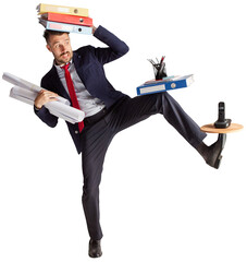 Young businessman in a suit juggling with office supplies in his office isolated on transparent background. Deadlines, overworking. Concept of dance and business, employment, success, career, office