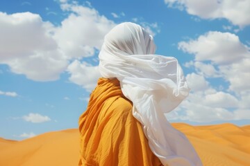 a woman portrait with face covered  under a big white silk cloth carried by the wind, floats dancing in a empty desert, vibrant colors palette color background	
