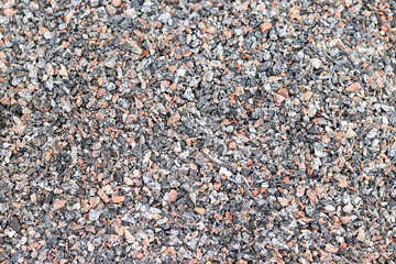 Crushed stone, close-up, top view. Fine granite crushed stone. Construction materials, background....