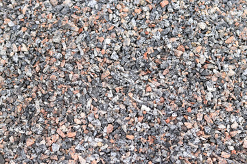 Crushed stone, close-up, top view. Fine granite crushed stone. Construction materials, background. Gravel