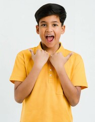 Portrait of a young indian boy showing thumbs up on white background
