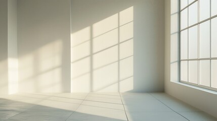 Fototapeta premium A large, empty room with a large window that lets in a lot of light. The room is very bright and open, with a lot of space to move around