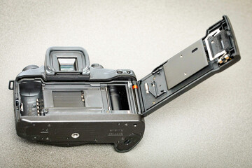 Analogue camera with back flap open, view of shutter.