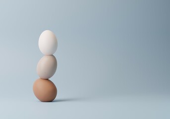 3d Concept about balance and strength, eggs on top of each other. Pastel Blue background with copy space. Minimal, elegant 3d rendering