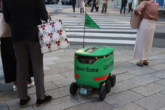 Uber Eats robot working on a street in Nihombashi, Tokyo, Japan. April 10, 2024