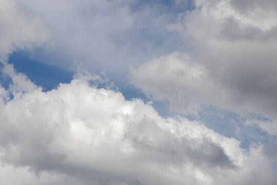 Blue sky with dense clouds, background, contemplation, immensity.