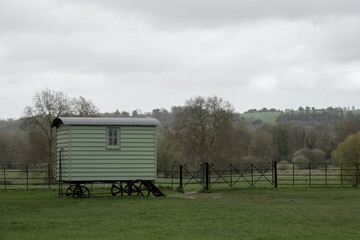 vintage green shepherds hut in the English countryside