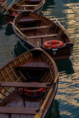 View of two beautiful wooden boats on Lago di Braies. Dolomites. Italy
