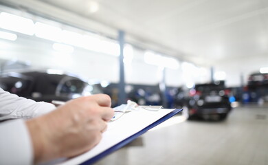 Car dealer places order in car dealership. Car service concept