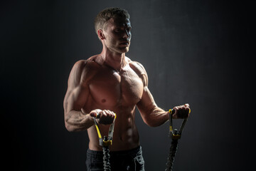 Strong man exercising suspension training trx. Sexy muscular man doing suspension training. Sport....