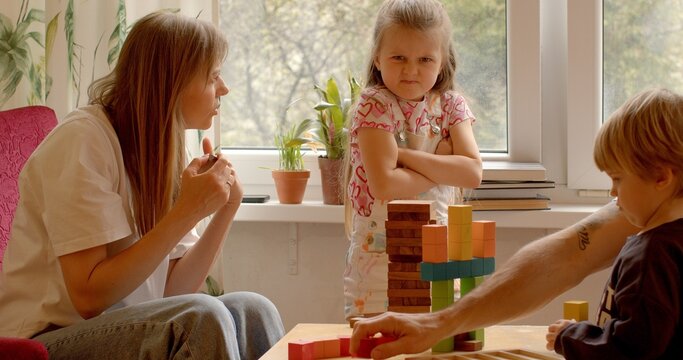 Childhood Challenges. Little girl and mother conflicts with parental values. Children questioning rules and authority at home. Emotional child seek independence and push back against parental control.