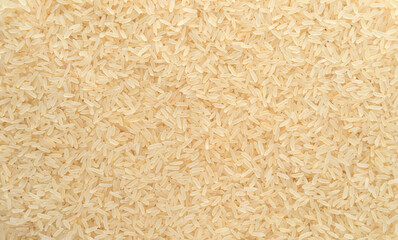 Basmati rice steamed close-up texture, brown rice background top view - 781390475