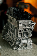 close up Disassembled engine block on the table the mechanic opened the locking valve mechanism...