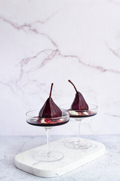 Poached Pears with spiced red wine reduction and vanilla bean yogurt