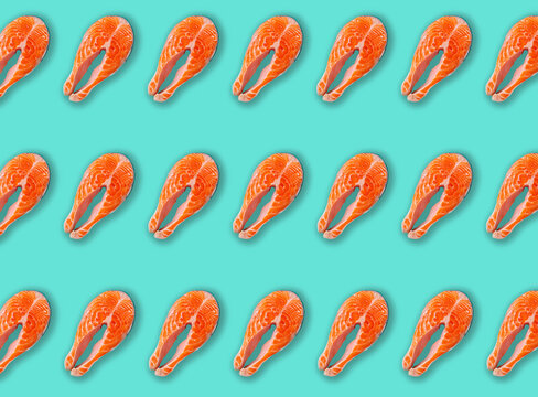 Raw fresh fish salmon steak top view on blue clean background