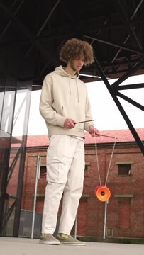Z generation male playing with a diabolo