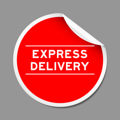 Red color peel sticker label with word express delivery on gray background