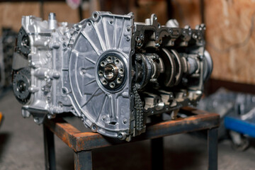 Disassembled engine block on the table the mechanic opened the locking valve mechanism Motor capital repair